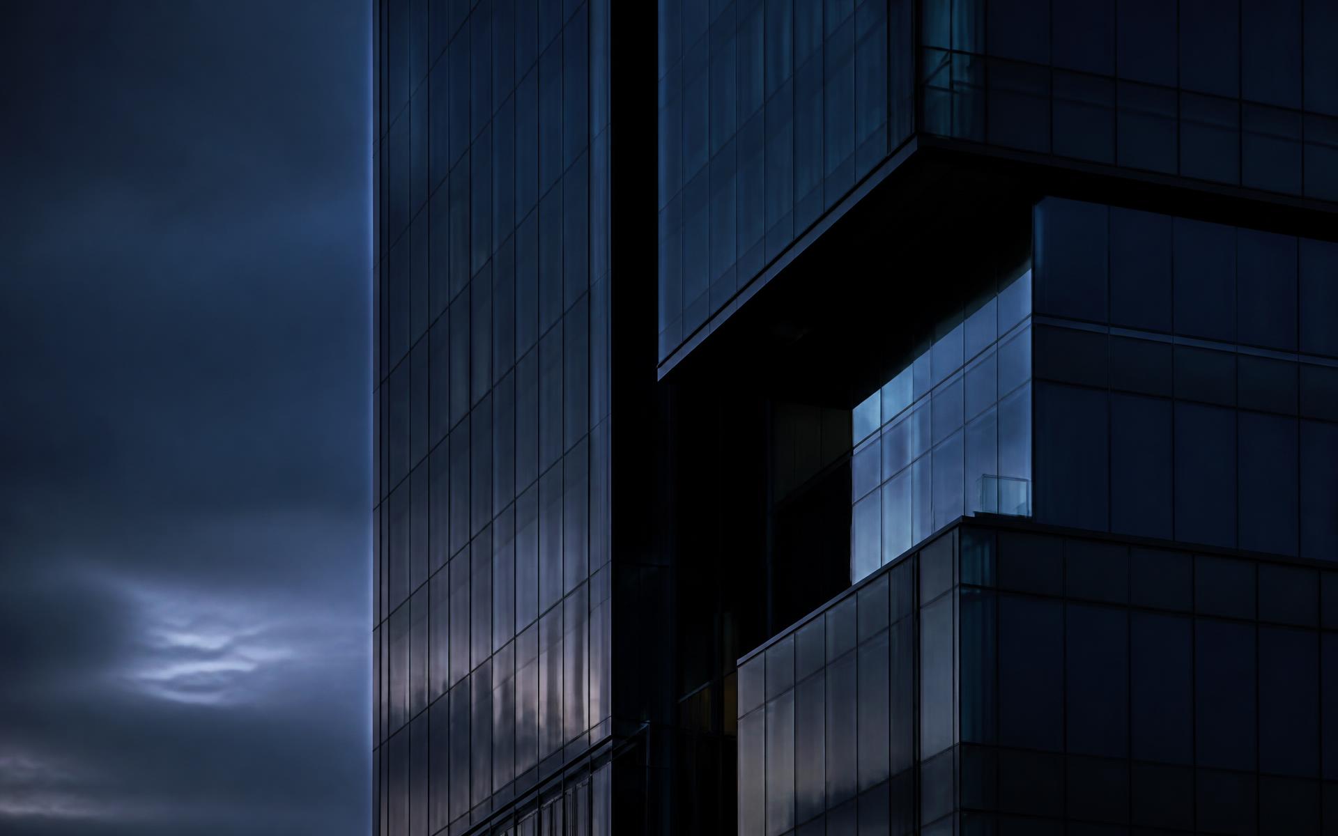 Modern corporate tower facade at dusk